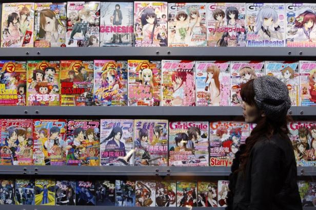 Woman browses the adult manga section at a manga convention